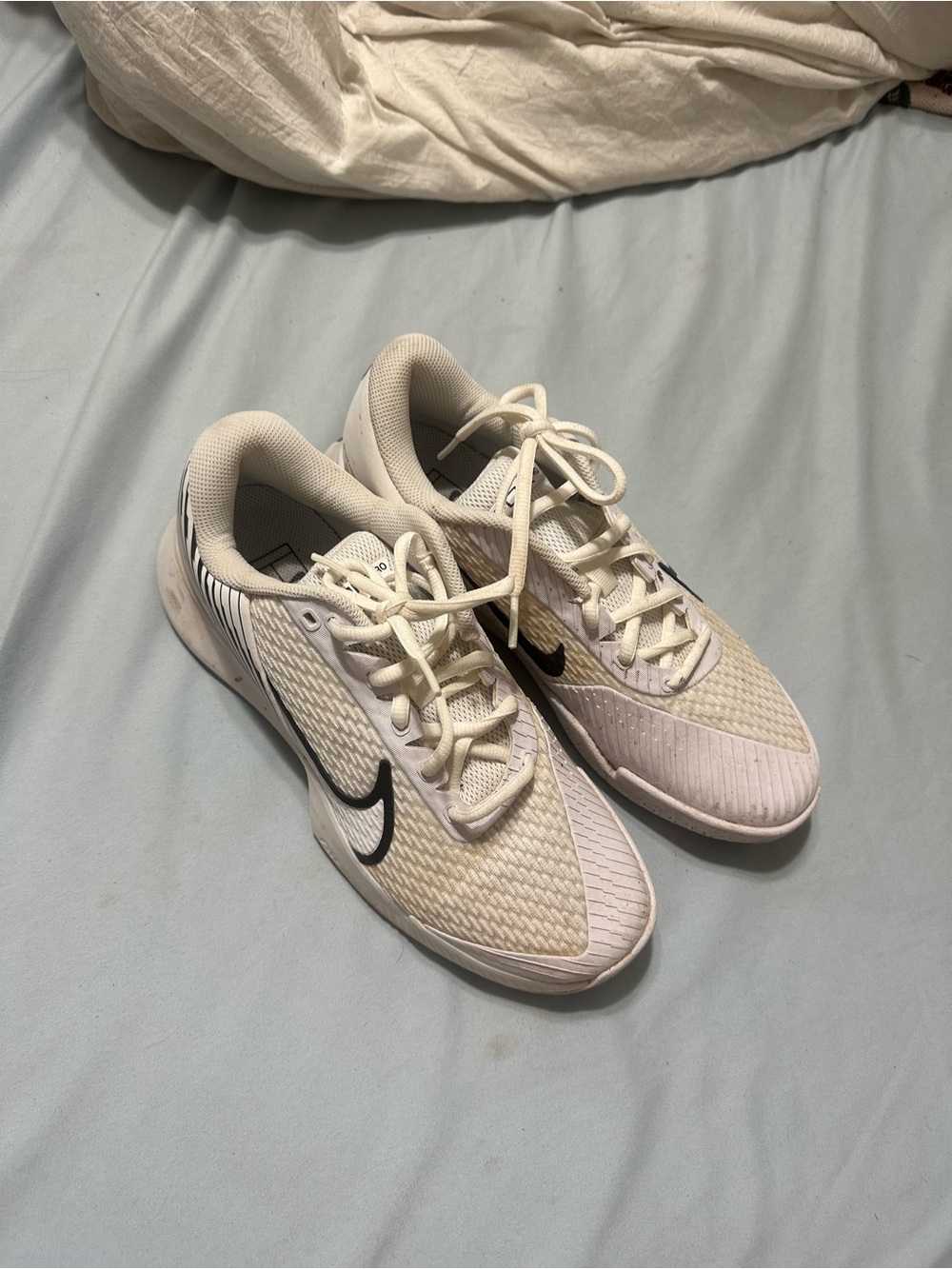 Nike Women’s White Athletic Sneakers with Black Swoosh Accent
